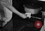 Image of housewife in 1930s United States USA, 1938, second 39 stock footage video 65675041917