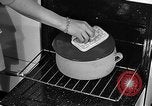 Image of housewife in 1930s United States USA, 1938, second 44 stock footage video 65675041917