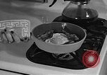Image of housewife in 1930s United States USA, 1938, second 53 stock footage video 65675041917