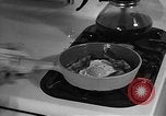 Image of housewife in 1930s United States USA, 1938, second 54 stock footage video 65675041917