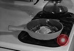 Image of housewife in 1930s United States USA, 1938, second 55 stock footage video 65675041917