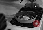 Image of housewife in 1930s United States USA, 1938, second 56 stock footage video 65675041917