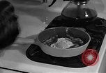 Image of housewife in 1930s United States USA, 1938, second 57 stock footage video 65675041917