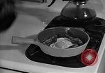 Image of housewife in 1930s United States USA, 1938, second 58 stock footage video 65675041917