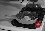 Image of housewife in 1930s United States USA, 1938, second 59 stock footage video 65675041917