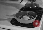Image of housewife in 1930s United States USA, 1938, second 61 stock footage video 65675041917