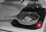 Image of housewife in 1930s United States USA, 1938, second 62 stock footage video 65675041917