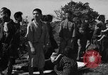 Image of Japanese civilians during invasion of Aguni Jima Okinawa Ryukyu Islands, 1945, second 36 stock footage video 65675042088