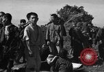 Image of Japanese civilians during invasion of Aguni Jima Okinawa Ryukyu Islands, 1945, second 38 stock footage video 65675042088