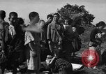 Image of Japanese civilians during invasion of Aguni Jima Okinawa Ryukyu Islands, 1945, second 46 stock footage video 65675042088