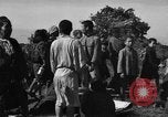Image of Japanese civilians during invasion of Aguni Jima Okinawa Ryukyu Islands, 1945, second 52 stock footage video 65675042088
