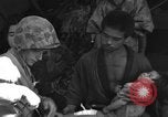 Image of injured Japanese children Okinawa Ryukyu Islands, 1945, second 51 stock footage video 65675042089