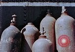Standbild Storage tank Hiroshima Japan, 1946, aus Sekunde 15 historischem Filmmaterial Videoclip 65675042131