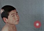 Standbild Haarausfall Nagasaki Japan, 1946, aus Sekunde 20 historischem Filmmaterial Videoclip 65675042176