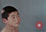 Standbild Haarausfall Nagasaki Japan, 1946, aus Sekunde 32 historischem Filmmaterial Videoclip 65675042176