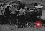 Image of house on fire China, 1945, second 29 stock footage video 65675042297