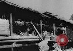 Image of house on fire China, 1945, second 11 stock footage video 65675042298