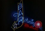 Standbild Neon Sign Saigon Vietnam, 1964, aus Sekunde 39 historischem Filmmaterial Videoclip 65675042316