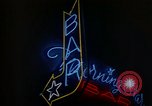 Standbild Neon Sign Saigon Vietnam, 1964, aus Sekunde 44 historischem Filmmaterial Videoclip 65675042316