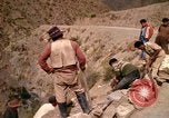 Image of construction of a road Bolivia, 1966, second 60 stock footage video 65675042328