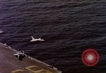 Image of Variety of  U.S. Navy aircraft landing on the USS Forrestal at sea Atlantic Ocean, 1959, second 25 stock footage video 65675042344