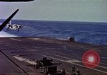Image of Variety of  U.S. Navy aircraft landing on the USS Forrestal at sea Atlantic Ocean, 1959, second 34 stock footage video 65675042344