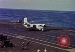 Image of Variety of  U.S. Navy aircraft landing on the USS Forrestal at sea Atlantic Ocean, 1959, second 37 stock footage video 65675042344