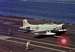Image of Variety of  U.S. Navy aircraft landing on the USS Forrestal at sea Atlantic Ocean, 1959, second 46 stock footage video 65675042344
