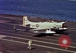 Image of Variety of  U.S. Navy aircraft landing on the USS Forrestal at sea Atlantic Ocean, 1959, second 47 stock footage video 65675042344