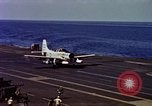 Image of Variety of  U.S. Navy aircraft landing on the USS Forrestal at sea Atlantic Ocean, 1959, second 54 stock footage video 65675042344