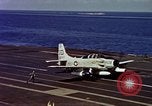 Image of Variety of  U.S. Navy aircraft landing on the USS Forrestal at sea Atlantic Ocean, 1959, second 58 stock footage video 65675042344