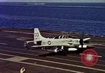 Image of Variety of  U.S. Navy aircraft landing on the USS Forrestal at sea Atlantic Ocean, 1959, second 61 stock footage video 65675042344