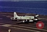 Image of Variety of  U.S. Navy aircraft landing on the USS Forrestal at sea Atlantic Ocean, 1959, second 62 stock footage video 65675042344
