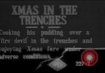 Image of British soldiers sharing Christmas pudding in trenches France, 1916, second 1 stock footage video 65675042463