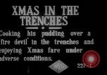 Image of British soldiers sharing Christmas pudding in trenches France, 1916, second 3 stock footage video 65675042463