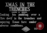 Image of British soldiers sharing Christmas pudding in trenches France, 1916, second 5 stock footage video 65675042463