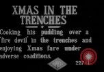 Image of British soldiers sharing Christmas pudding in trenches France, 1916, second 6 stock footage video 65675042463