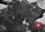 Image of British soldiers sharing Christmas pudding in trenches France, 1916, second 9 stock footage video 65675042463