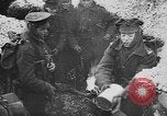 Image of British soldiers sharing Christmas pudding in trenches France, 1916, second 10 stock footage video 65675042463