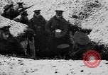 Image of British soldiers sharing Christmas pudding in trenches France, 1916, second 15 stock footage video 65675042463