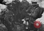 Image of British soldiers sharing Christmas pudding in trenches France, 1916, second 27 stock footage video 65675042463