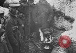 Image of British soldiers sharing Christmas pudding in trenches France, 1916, second 28 stock footage video 65675042463