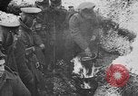 Image of British soldiers sharing Christmas pudding in trenches France, 1916, second 29 stock footage video 65675042463