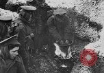 Image of British soldiers sharing Christmas pudding in trenches France, 1916, second 30 stock footage video 65675042463
