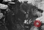 Image of British soldiers sharing Christmas pudding in trenches France, 1916, second 31 stock footage video 65675042463