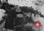 Image of British soldiers sharing Christmas pudding in trenches France, 1916, second 34 stock footage video 65675042463