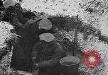 Image of British soldiers sharing Christmas pudding in trenches France, 1916, second 35 stock footage video 65675042463