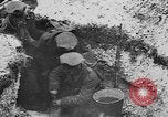 Image of British soldiers sharing Christmas pudding in trenches France, 1916, second 37 stock footage video 65675042463