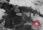 Image of British soldiers sharing Christmas pudding in trenches France, 1916, second 38 stock footage video 65675042463