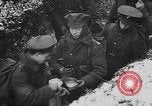 Image of British soldiers sharing Christmas pudding in trenches France, 1916, second 40 stock footage video 65675042463